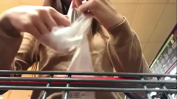 Cute Redhead shops for and uses cucumber