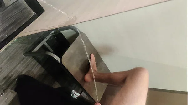 Pissing in a Fitting Room, Using a Pair of Pants