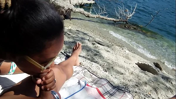 Public beach. Wife jerking and sucking me off. Being watched.