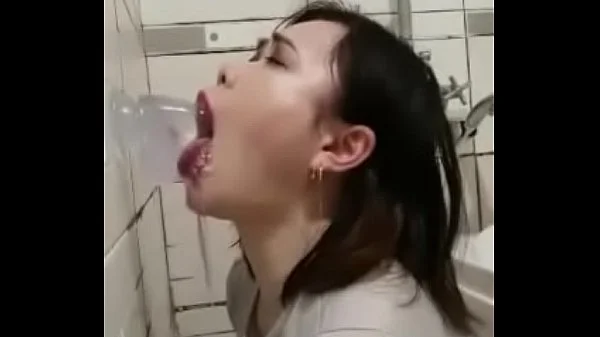 Asian deepthroating a dildo