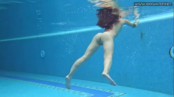Sexiest petite teen Lizi Vogue swims naked in the pool