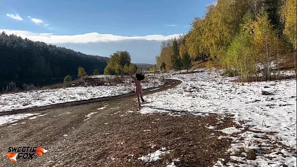 Сrazy girl takes off her clothes in cold and warms up with sex in the autumn forest